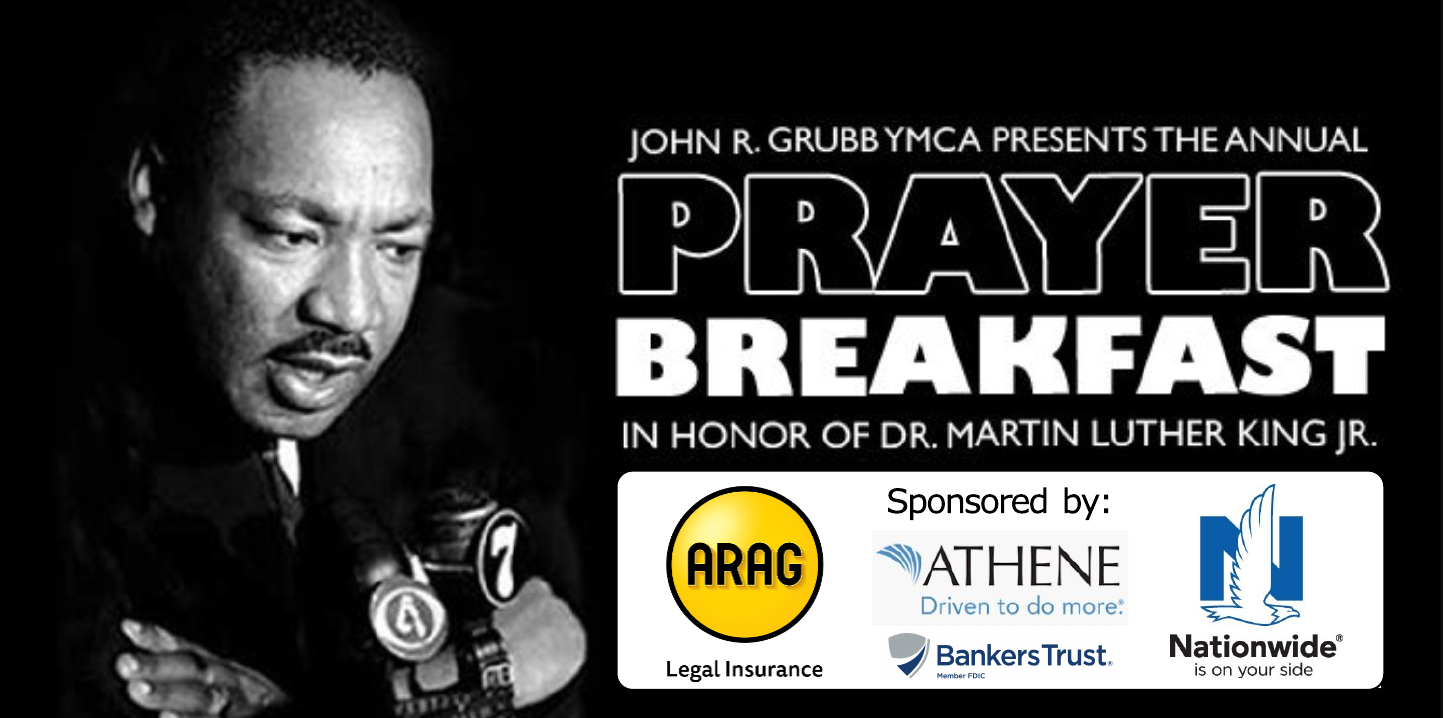 Black and white image of Martin Luther King Jr. speaking into microphones with the words "John R. Grubb YMCA Presents the annual Prayer Breakfast in honor of Dr. Martin Luther King Jr."